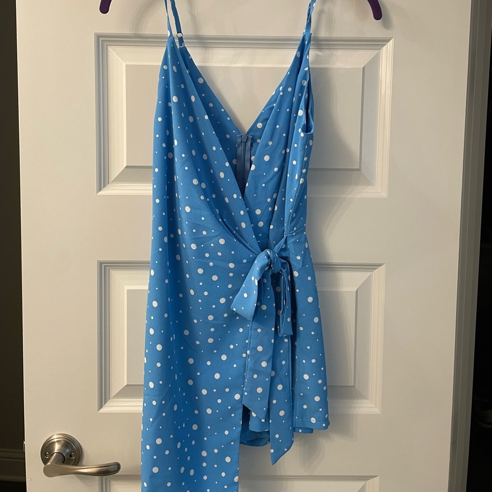 Blue romper with white polka dots